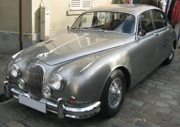 Silver Jaguar MKII on Borrani Wheels and 180 HR 15 Michelin XAS Tires